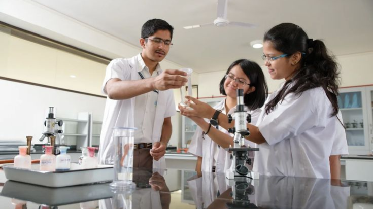 Students performing practical paramedical laboratory training at Techheal Paramedical Institute Pune